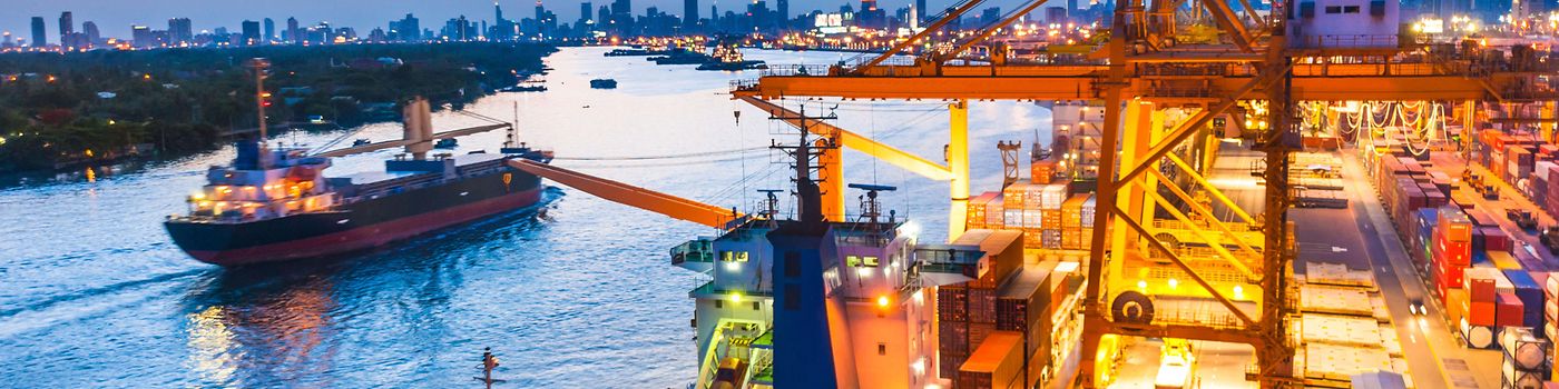 Shipping channel with several tankers at dusk