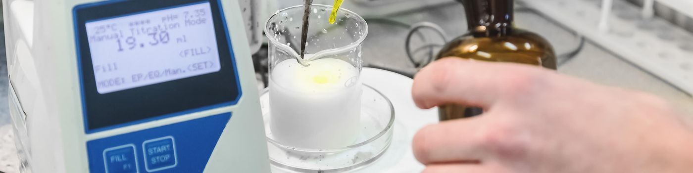 HERO-Laborant makes test in research laboratory with electronic measuring equipment on pharmaceutical industry manufacture or chemical plant