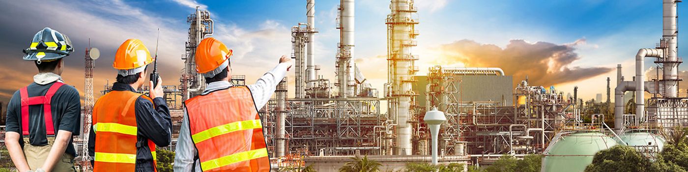 Engineers survey a refinery